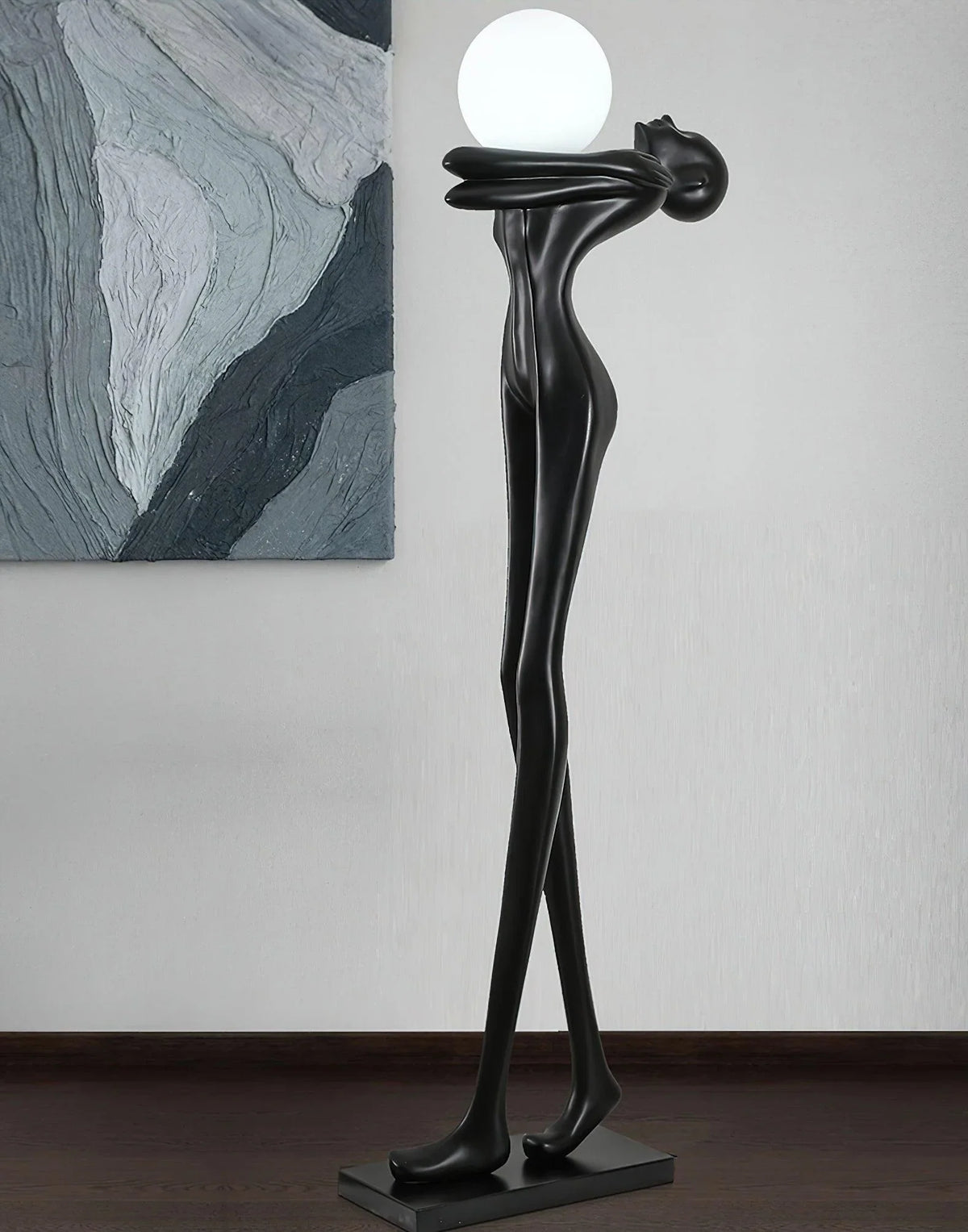 Decorative humanoid abstract floor lamp with a spherical light