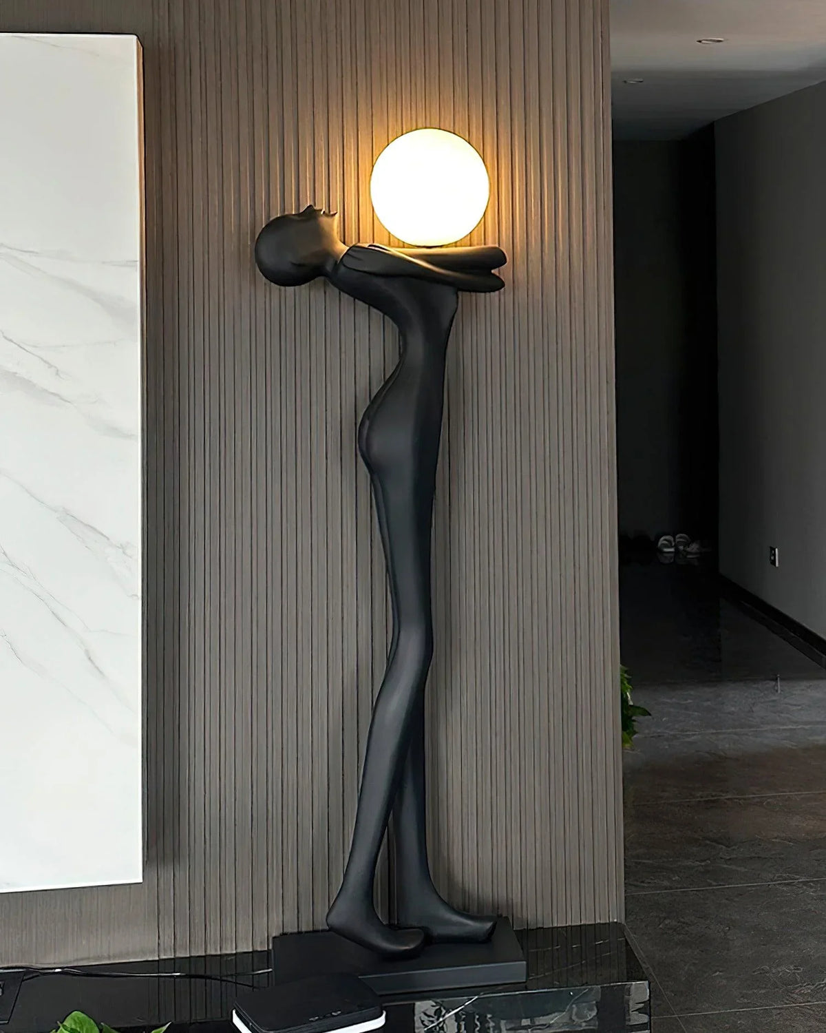 Sophisticated humanoid floor lamp with abstract design and round light