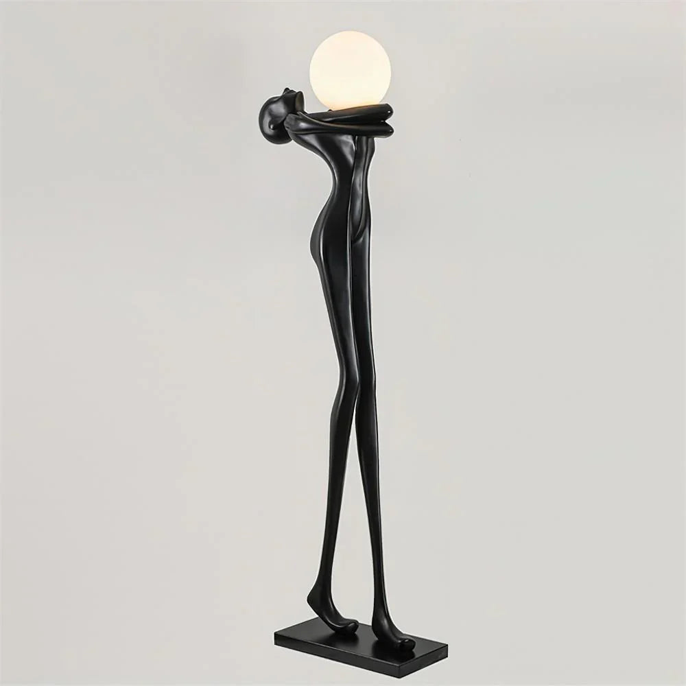 Sleek black humanoid abstract floor lamp enhancing room decor