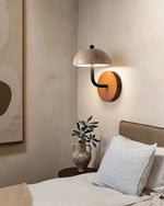 Travertine Hat Wall Lamp next to the bed