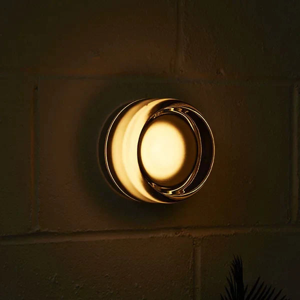 dimple wall sconce at night