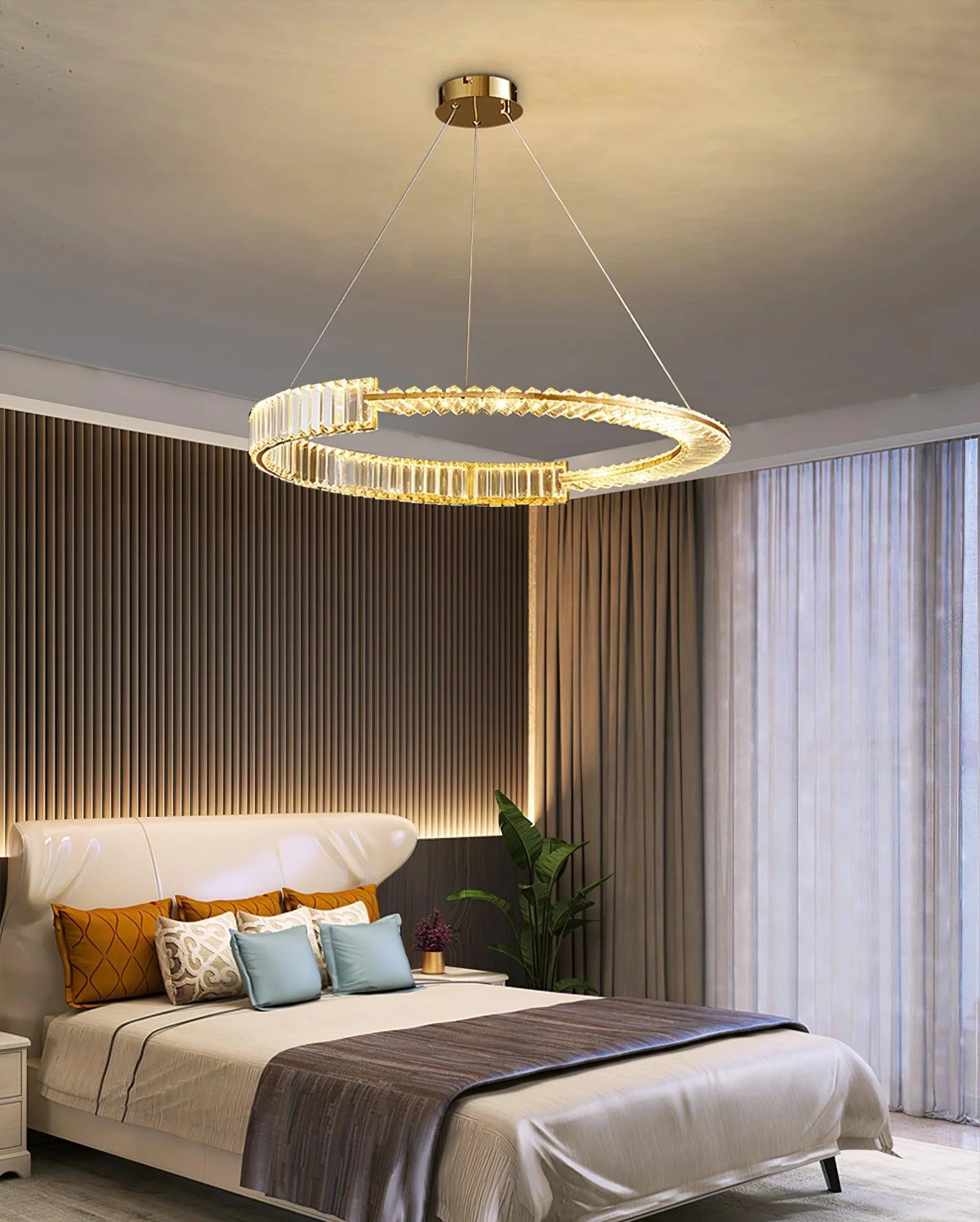 Dramatic evening illumination of torus-shaped chandelier