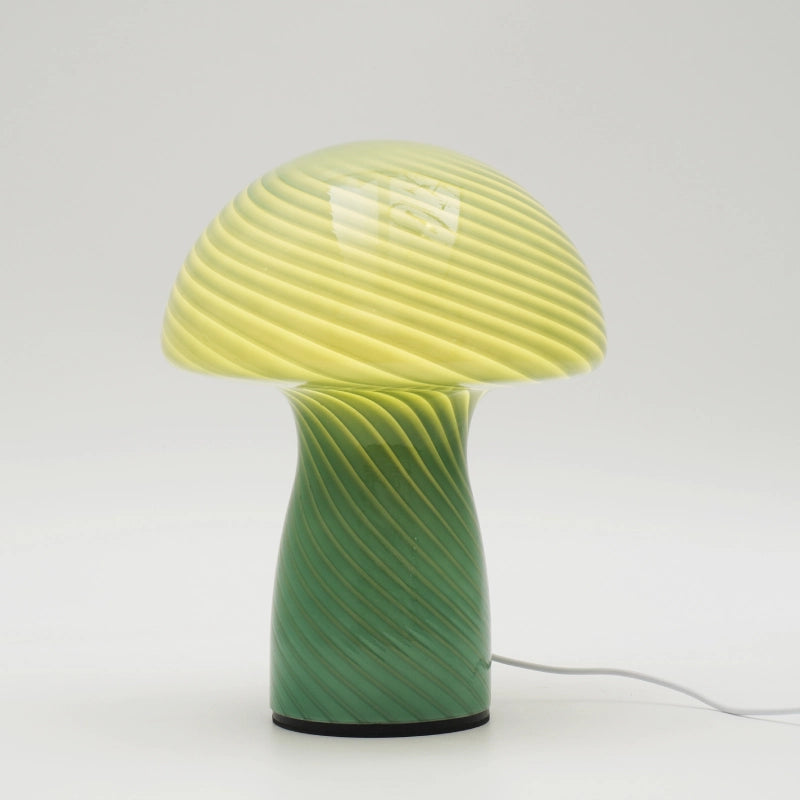 Green and yellow mushroom-shaped lamp on a white background