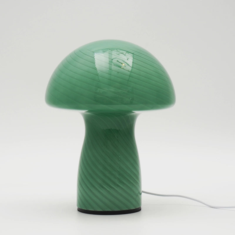 Green mushroom-shaped lamp on a white background