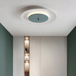 White round lamp with white outer ring and blue-green core, soft light. 