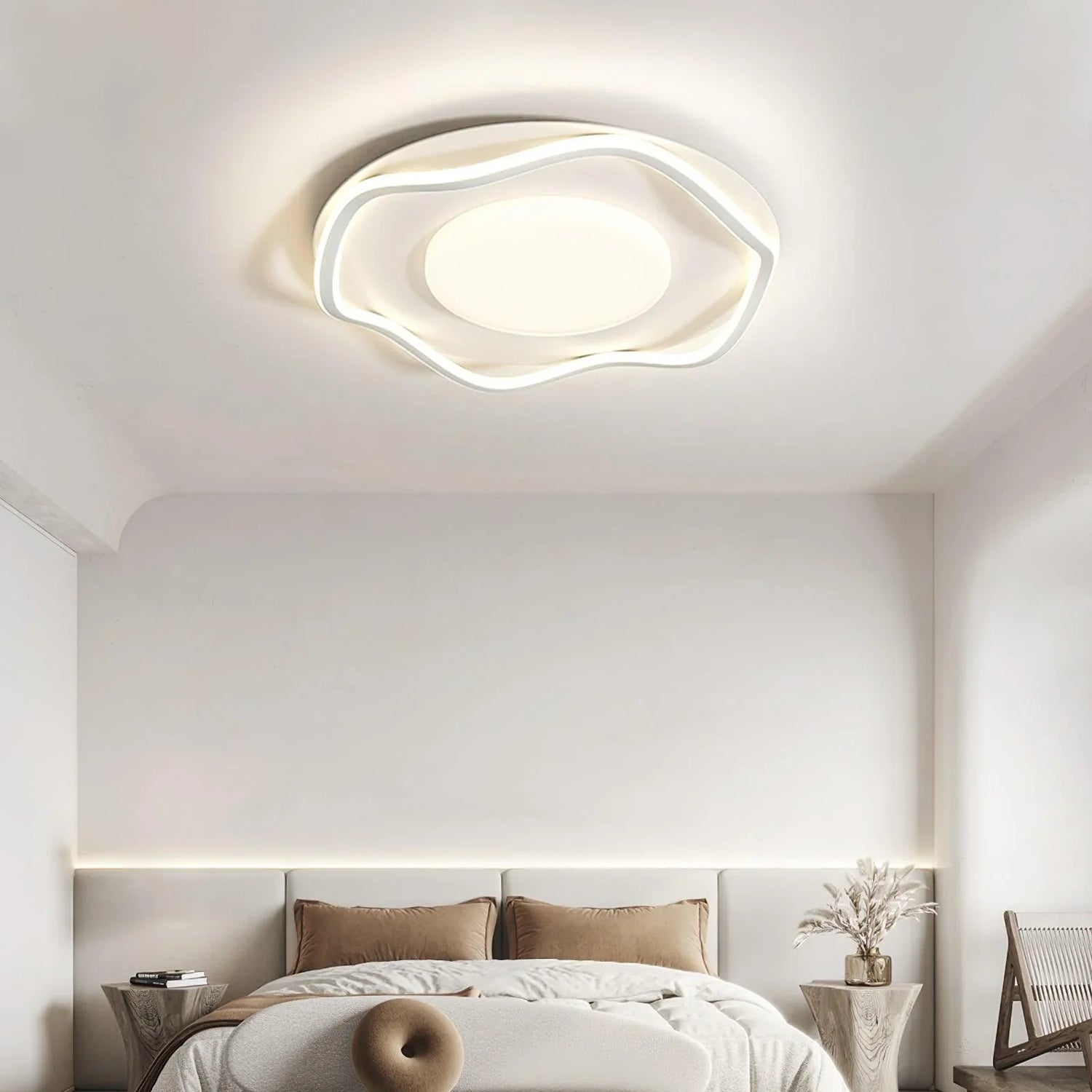 Modern ceiling light with smooth curves brightens the bedroom, adding stylish charm.