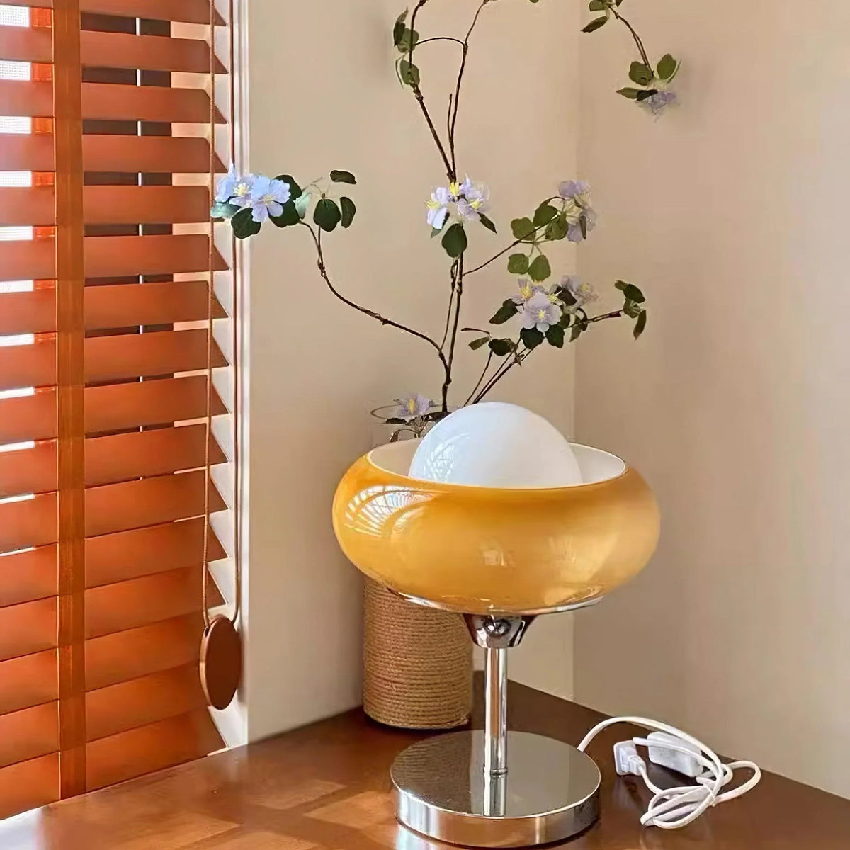 A white glass desk Lamp_near the blinds