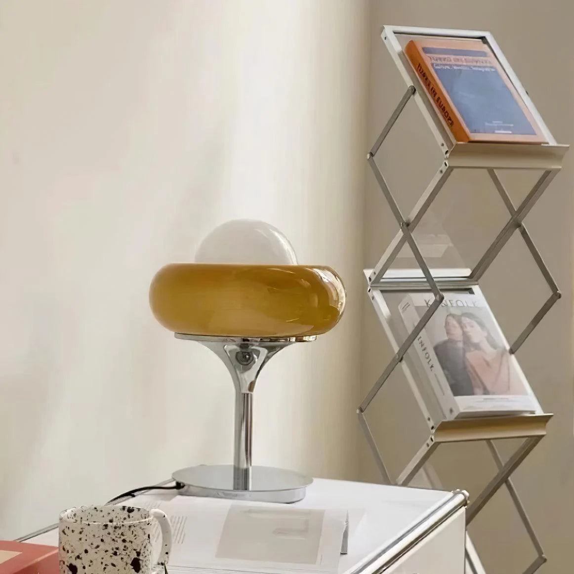 Nordic_Egg_Tart_Table_Lamp_next to the bookshelf