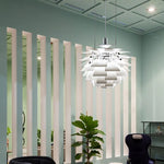 The white pine cone lamp emits a comfortable light in a corner of the office