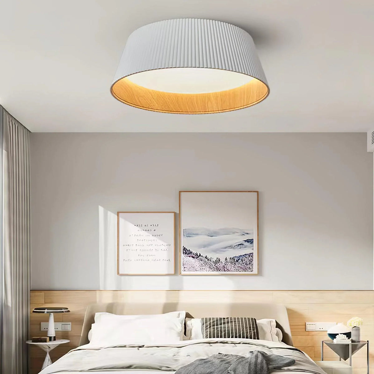 White nordic ceiling light next to a draw