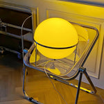 Modern Yellow Round Table Lamp illuminates the corner of the room