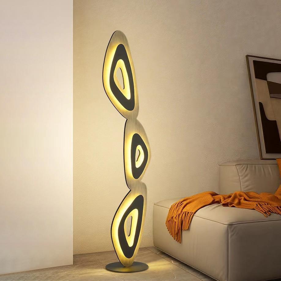Elegant lamp with curvy tiers fits living rooms, offices stylishly.
