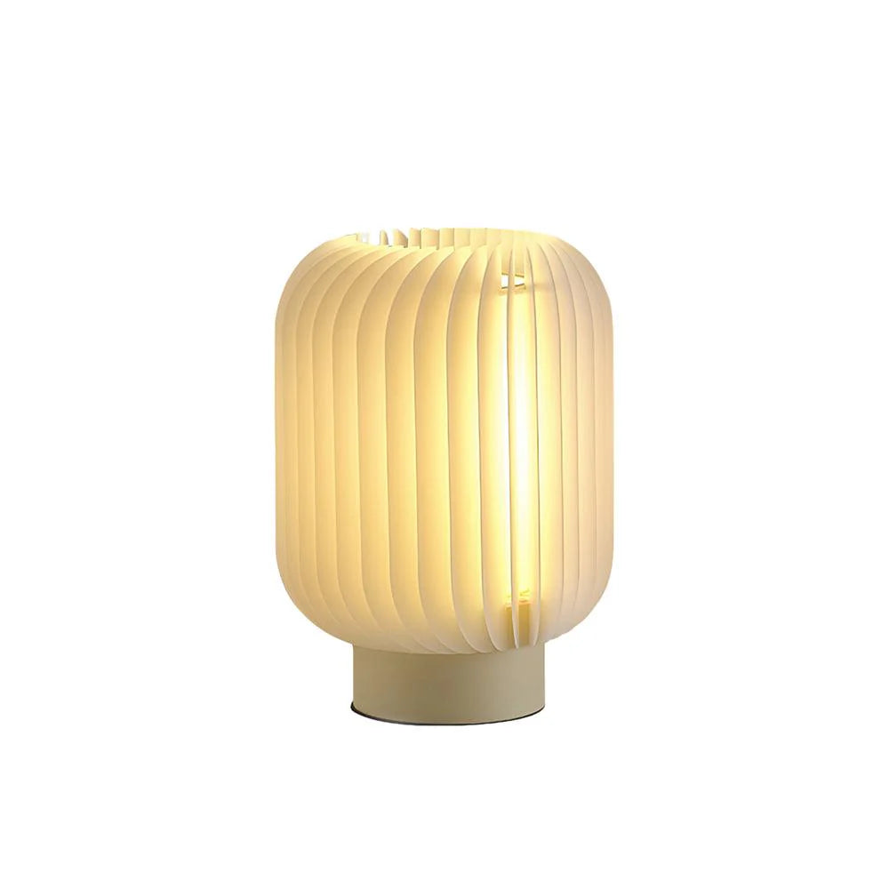 Elegant lamp features ribbed design for gentle bedroom glow.