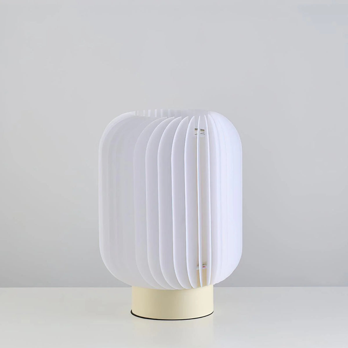 Stylish table lamp uses acrylic and fabric, creating a warm, textured lighting effect.