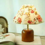 Lunitidal Table Lamp on the book