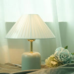 Lunitidal Table Lamp near the paper flower