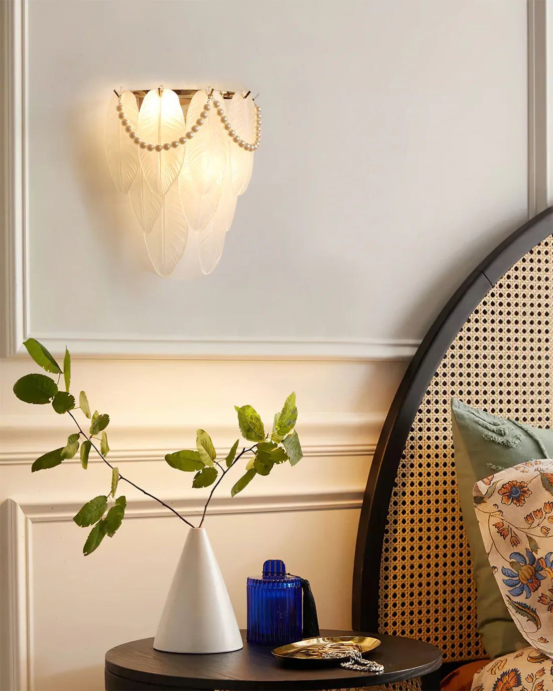 An elegant Pearl Feather Wall Lamp, infusing spaces with romantic charm through its soft, artistic design.