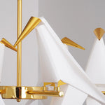 Gold and white chandelier with geometric design on a light gray background
