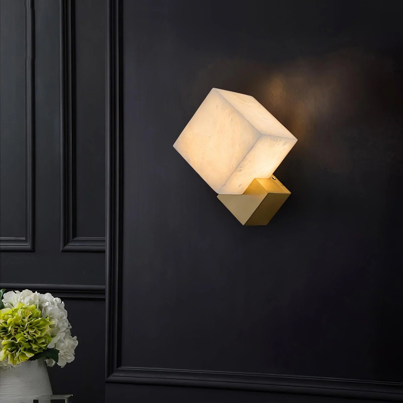 Natural marble cube pairs with a golden base, crafting a chic wall lighting solution.