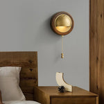 Pull‑chain switch controls warm downward glow from this compact Voss Wall Lamp