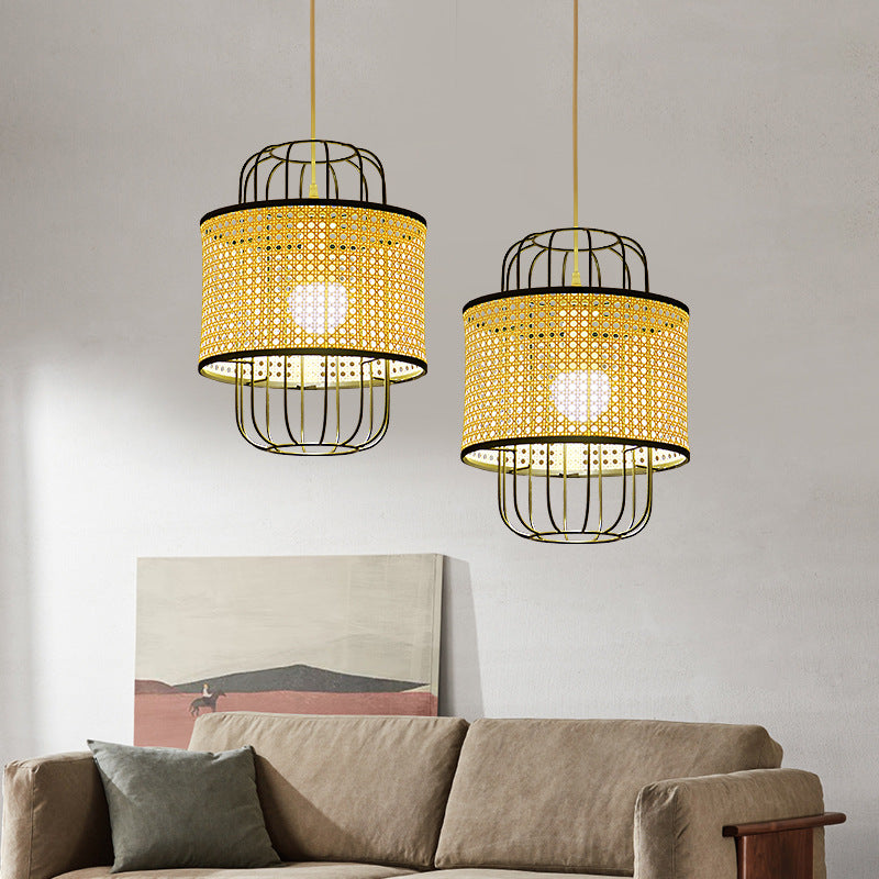 Handwoven rattan pendant lamp with a natural fiber shade, casting soft ambient light in a modern dining room.