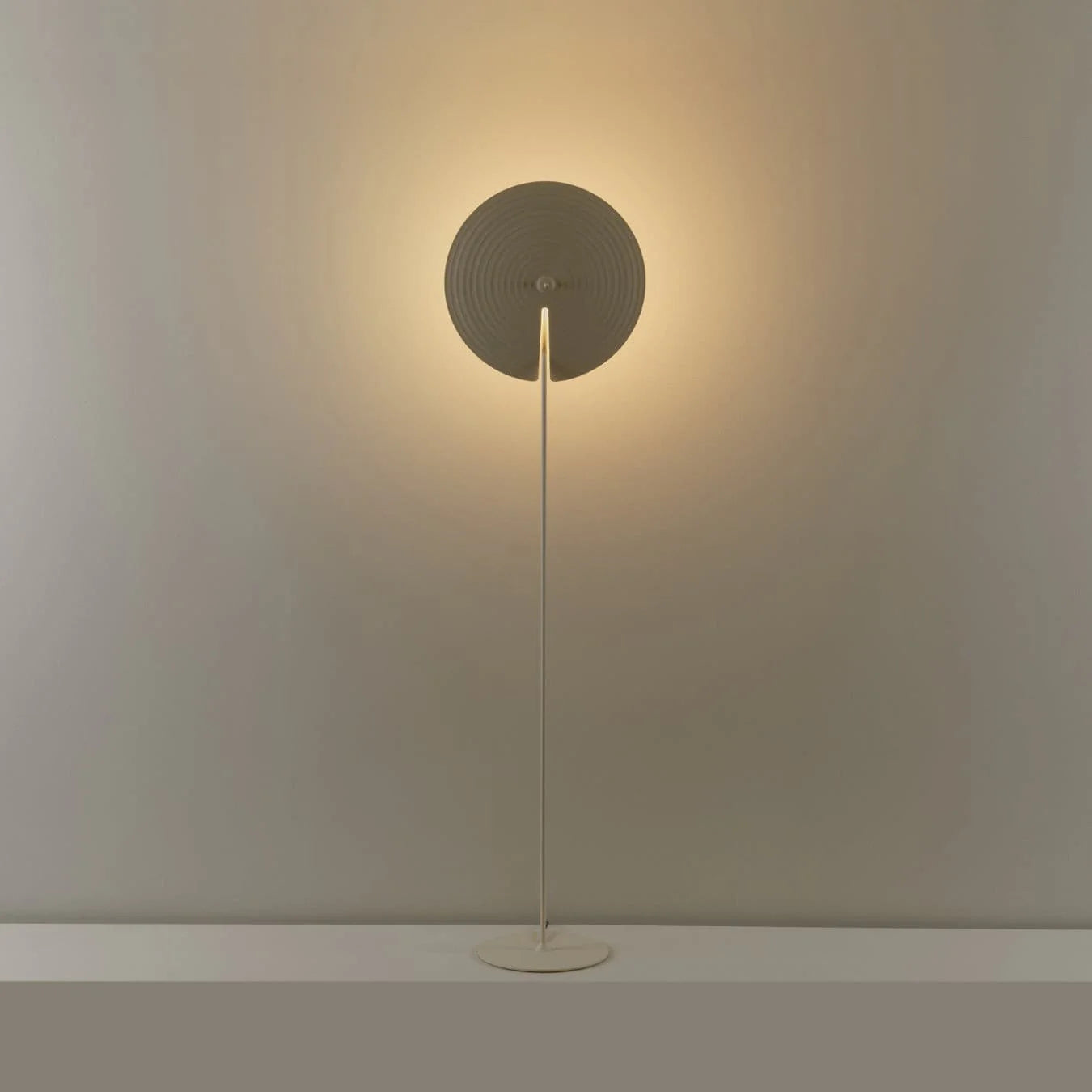 Perfect for living rooms, this floor lamp features a stable base and a slim pole for a sleek look.