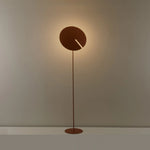 A vibe creator in the living room corner—this floor lamp lights up warm scenes with its unique design.