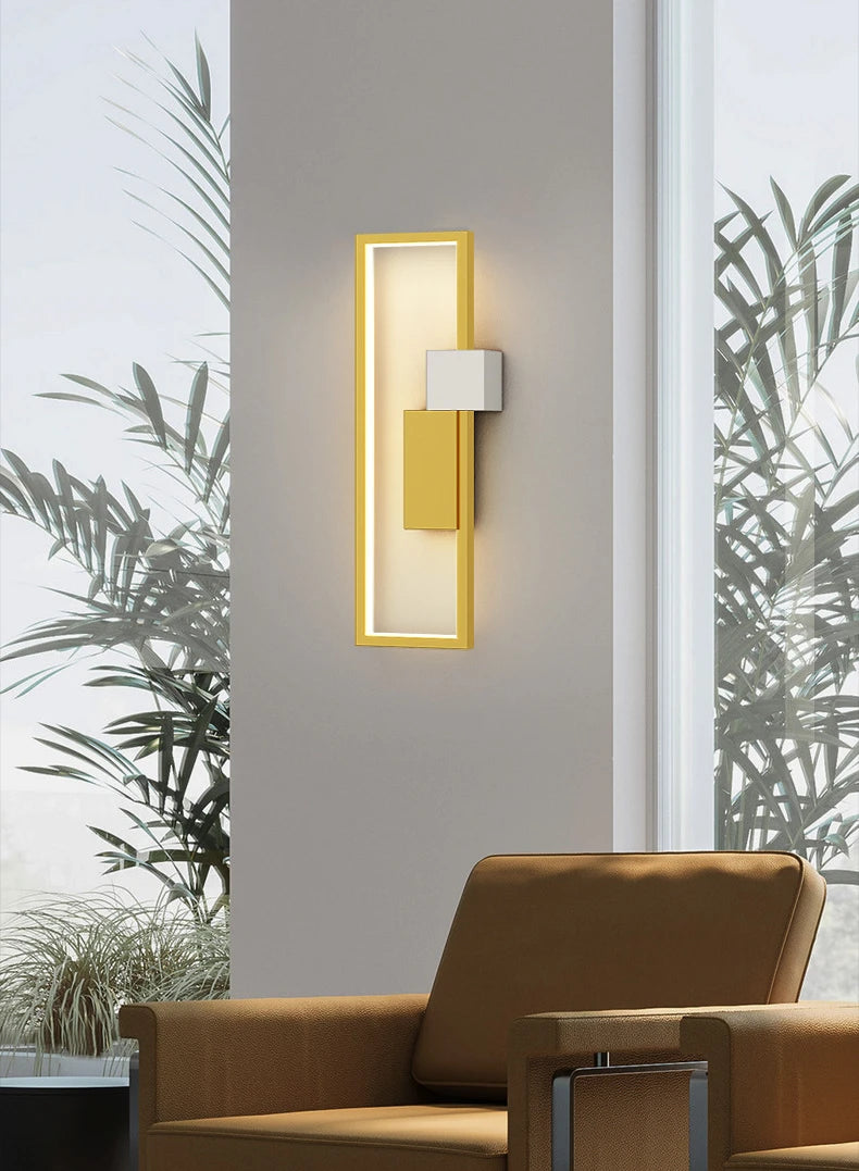 Gold wall lamp is mounted in the wall of dining room