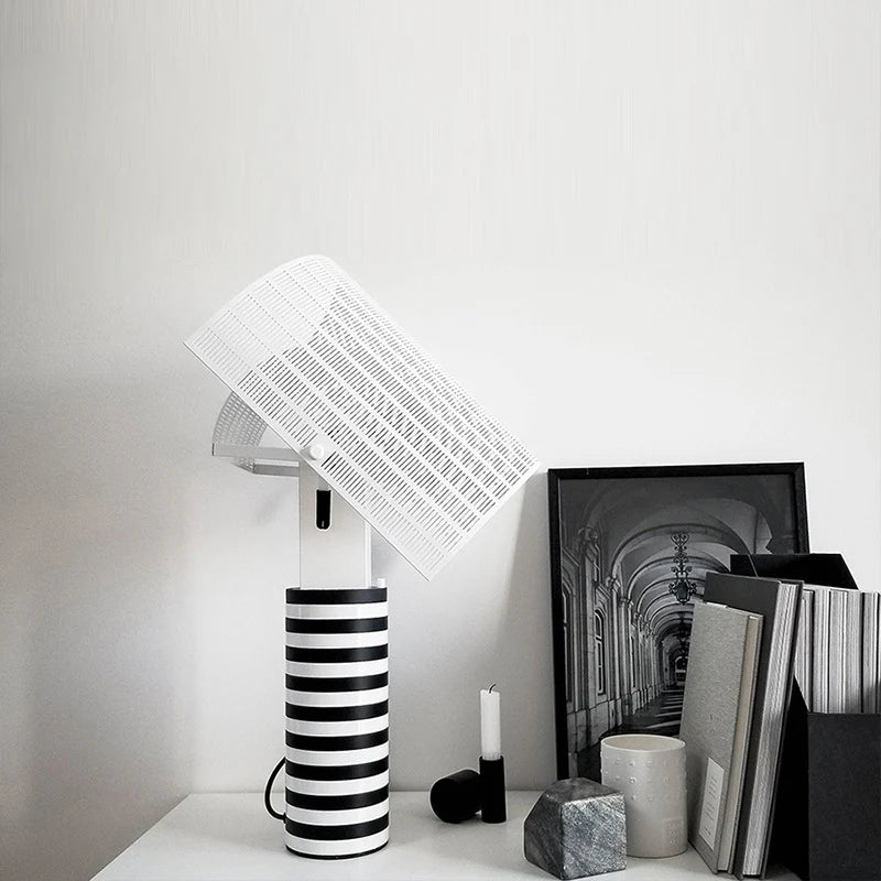 Shogun table lamp adjustable metal shade striped base styled on study desk with books and decor items