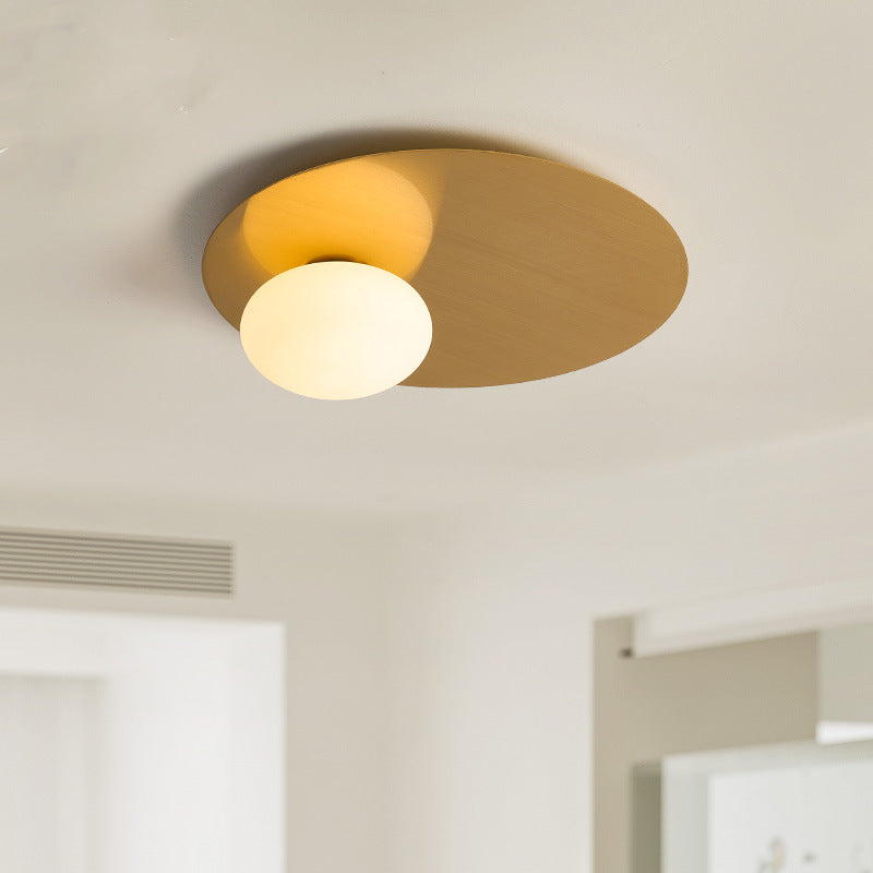 The smooth metal lamp body of the Simple Oval Ceiling Light reflects the oval white lampshade