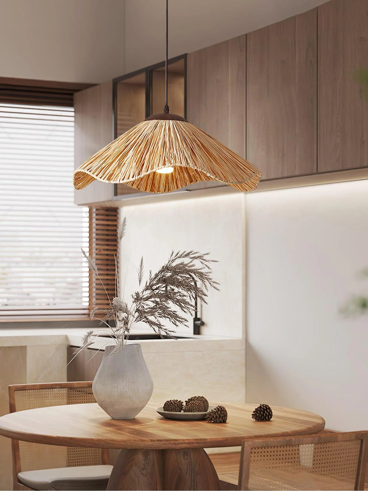 Cluster of three straw lamps hung at varying heights in bohemian living room