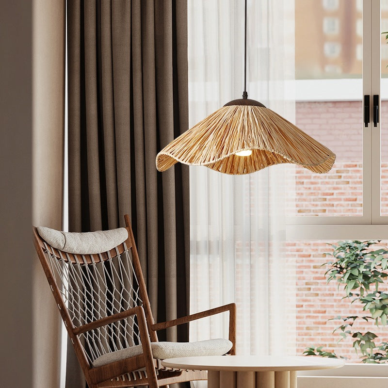 Artisan crafting straw lamp using traditional weaving techniques