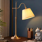 Suffolk Table Lamp illuminates the desk at night