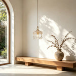 Sun‑dappled entryway wall glows gently under our compact American Crystal Pendant Lamp