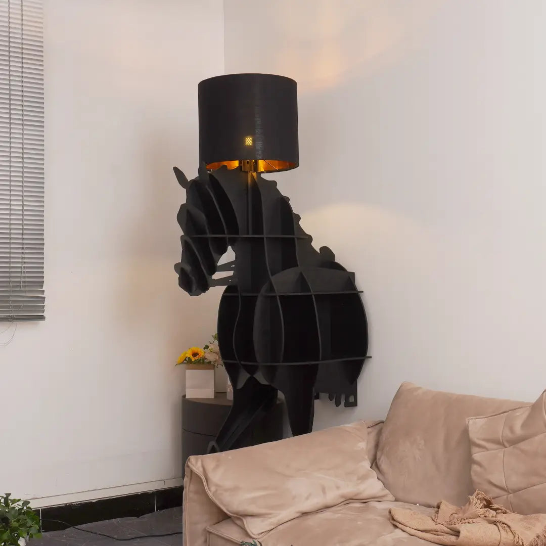 Lit Tete Horse Floor Lamp casts warm glow from black fabric shade, adding artistic vibe to minimalist living room