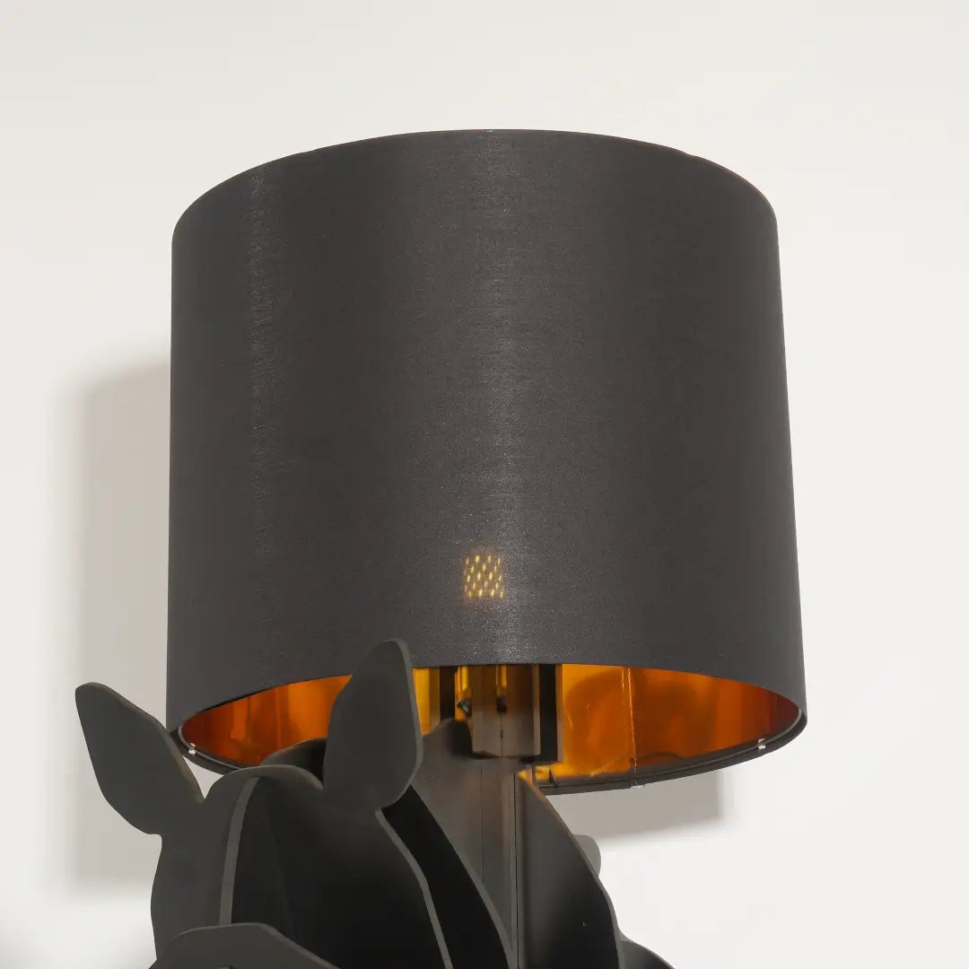 Close-up of lit Tete Horse Floor Lamp's fabric shade, highlighting warm golden inner lining and soft light diffusion