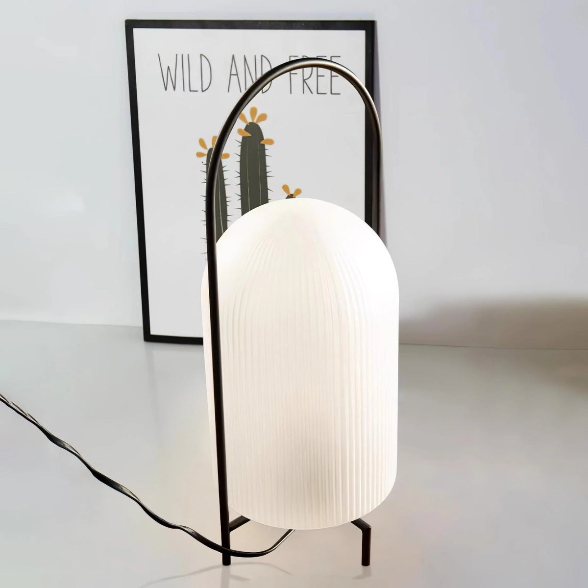 Portable glass lantern with ghost design, ideal for outdoor adventures.