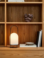 Lightweight ghost lamp with handle, ideal for camping trips or garden gatherings.