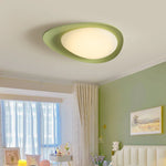 Stylish green ceiling lamp features flowing curves, perfect for contemporary decor.