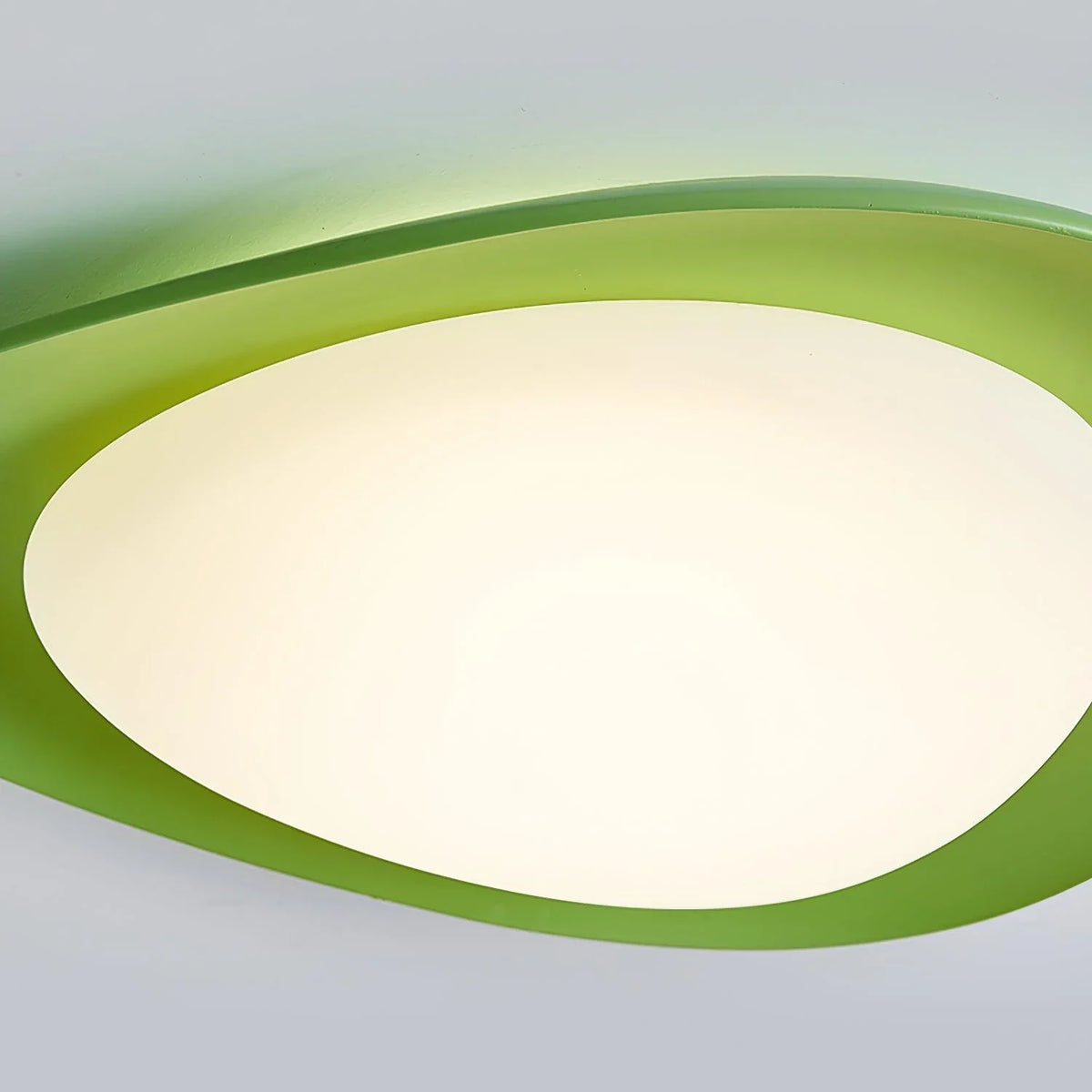 Sleek green ceiling fixture—its curved design creates an eye-catching focal point.