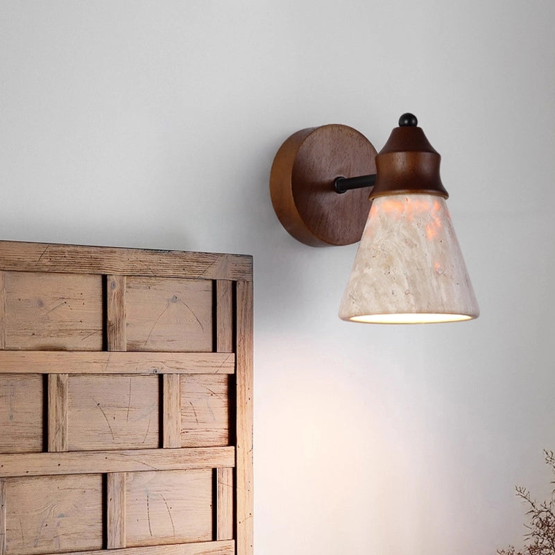 Travertine Wabi-sabi Wall Lamp: Wood-base wall light with textured travertine shade, casting soft glow beside rustic wooden decor (wabi-sabi style).