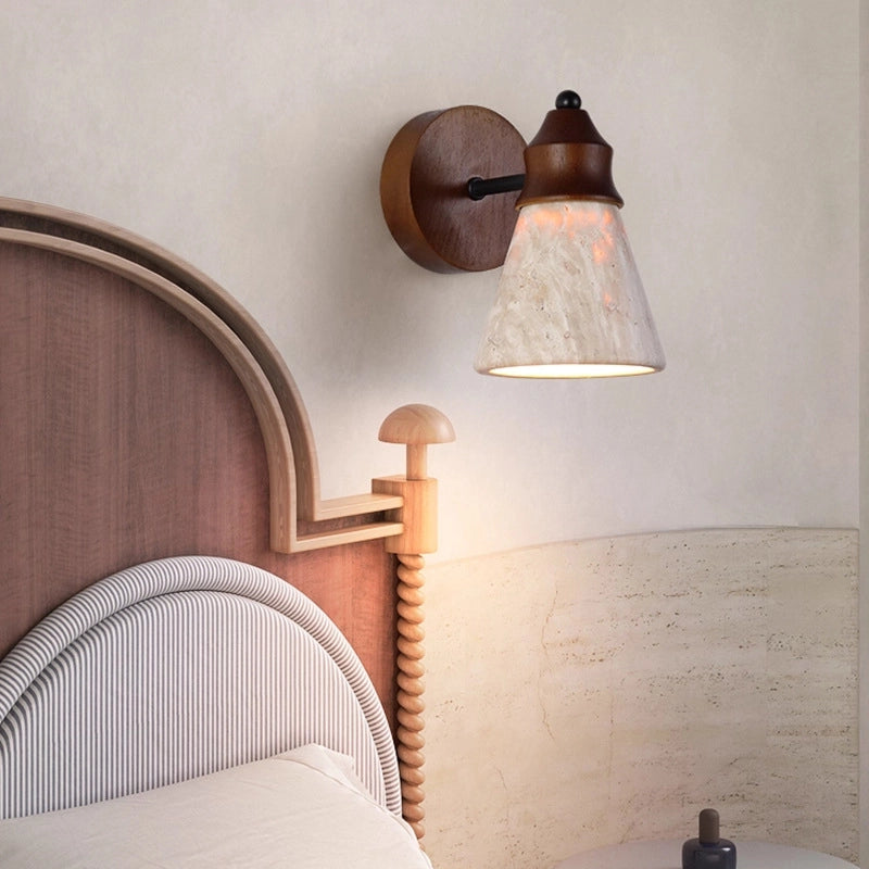 Travertine Wabi-sabi Wall Lamp: Wood-mounted light with textured travertine shade, emits soft glow above a stylized bedroom headboard (wabi-sabi aesthetic).