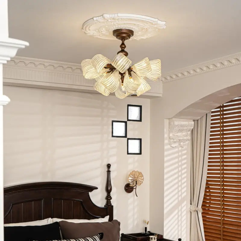 Vintage butterfly glass semi flush ceiling light installed in traditional bedroom, dark wood bed, french country interior, warm ambient lamp glow