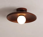 Quietly elevates interiors; the understated flat wooden silhouette adds vintage flair without overshadowing other elements