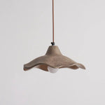 Keeping a minimalist curved look, wavy cement pendant light decorates indoor space with lamp off