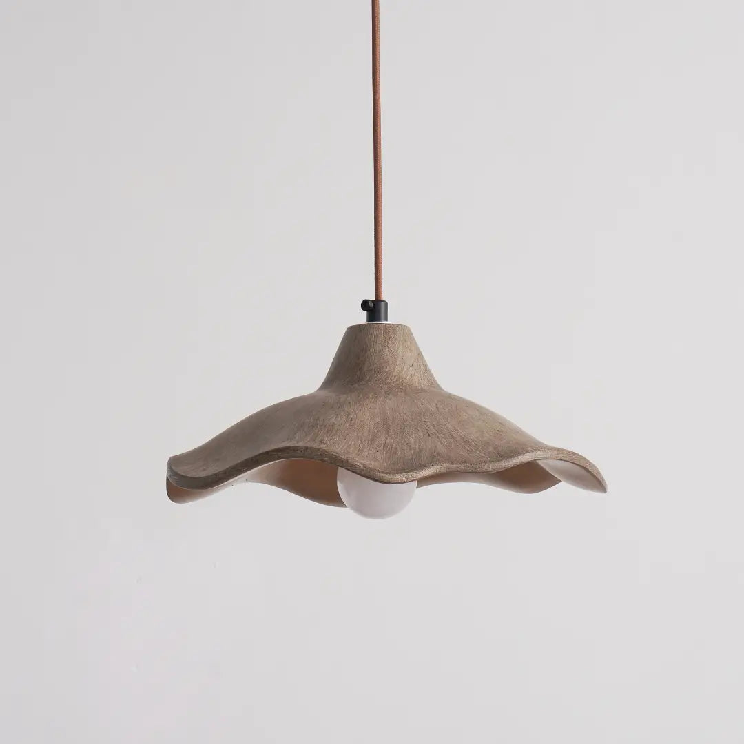 Keeping a minimalist curved look, wavy cement pendant light decorates indoor space with lamp off