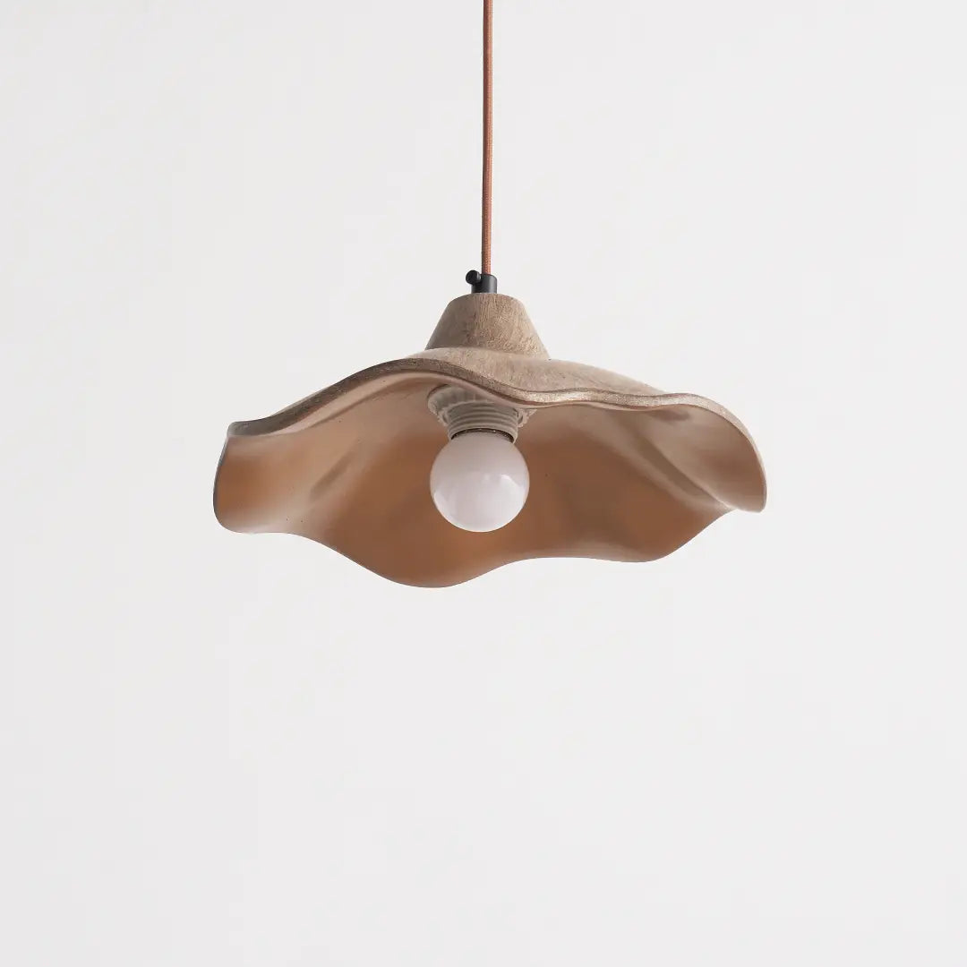 unlit wavy cement pendant light features organic curved lines to enrich living room ceiling aesthetics