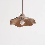 unlit wavy cement pendant light features organic curved lines to enrich living room ceiling aesthetics