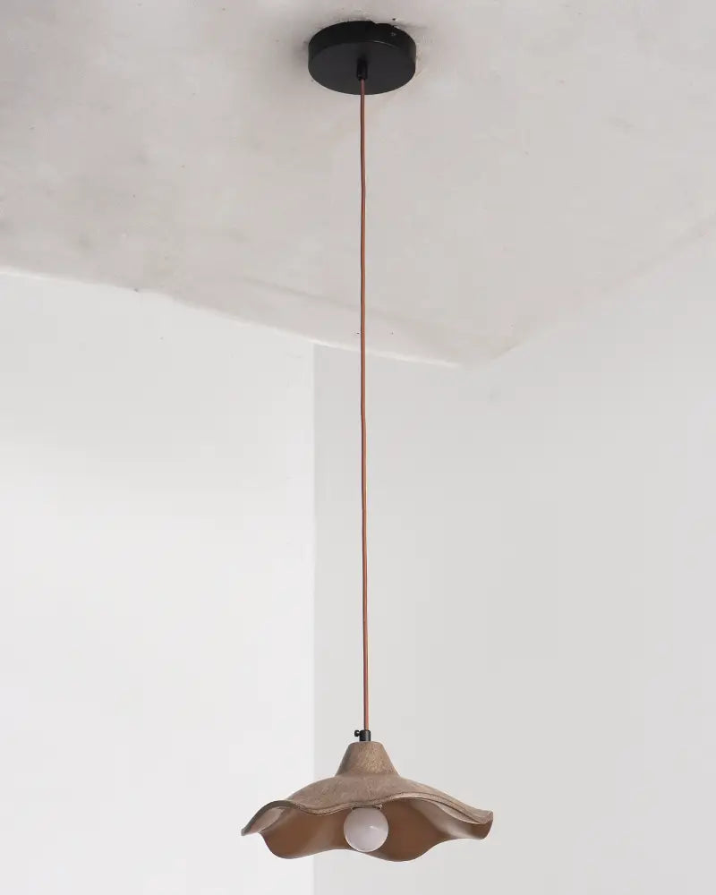 wavy cement pendant light presents organic curved form ideal for modern minimalist home
