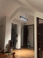 The vintage wood pendant light is installed on the ceiling in front of the door, which is very textured.
